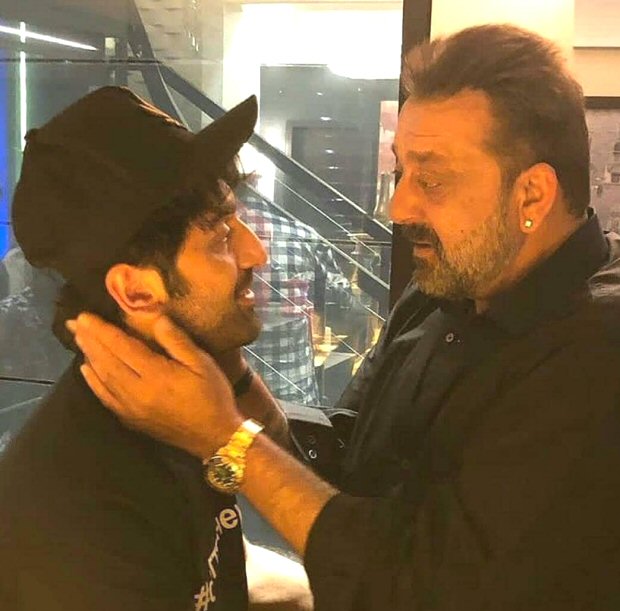 Ranbir Kapoor and Sanjay Dutt caught in a candid moment as they catch up ahead of Sanju release