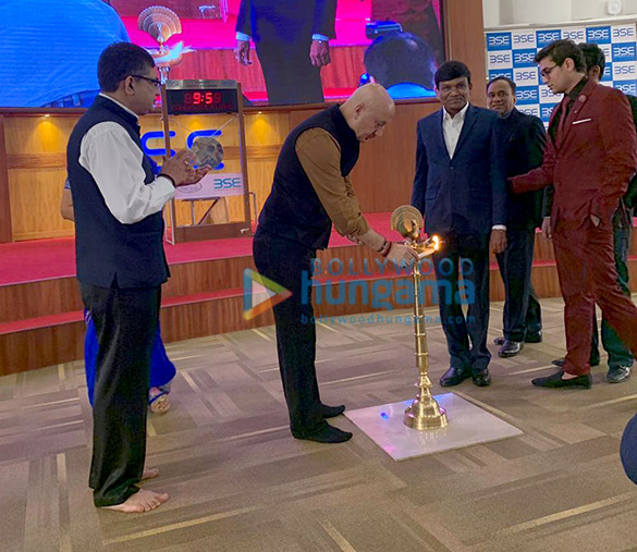 Anupam Kher rings the bell to open stock market to promote his film ‘The Accidental Prime Minister’ Anupam Kher rings the bell to open stock market to promote his film 'The Accidental Prime Minister'