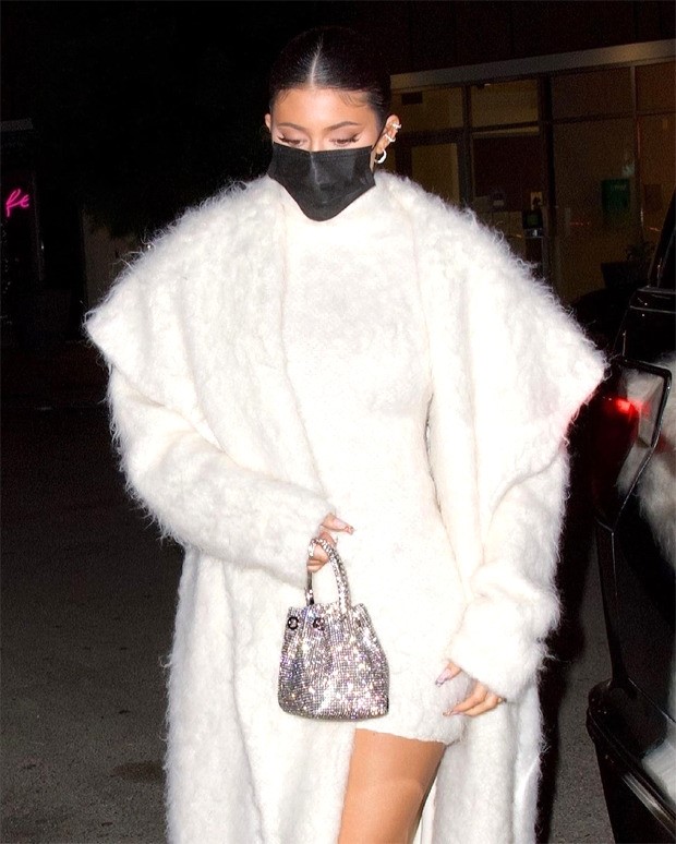 Kylie Jenner aces monotone look with fuzzy white bodycon & faux fur overcoat for dinner outing 