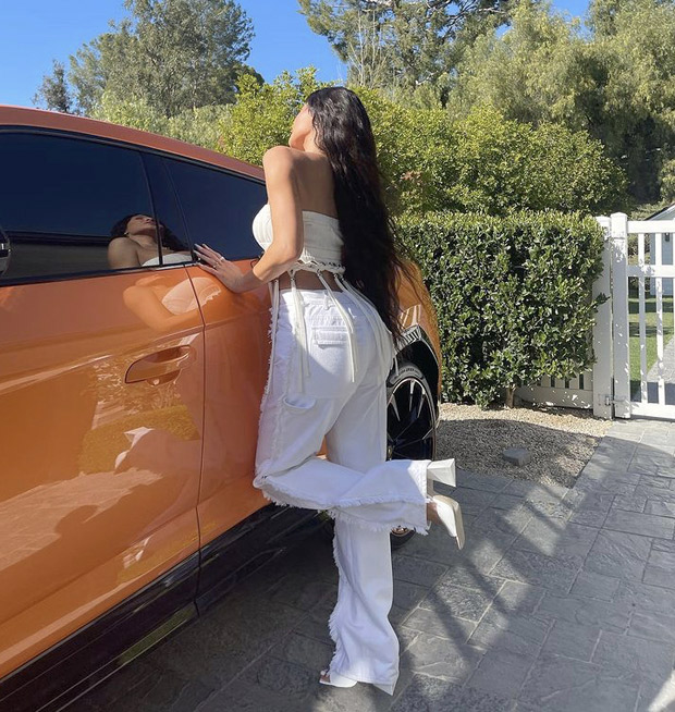 Kylie Jenner flaunts her summer wardrobe while striking a pose with her Lamborghini Urus worth over Rs. 3.10 crores
