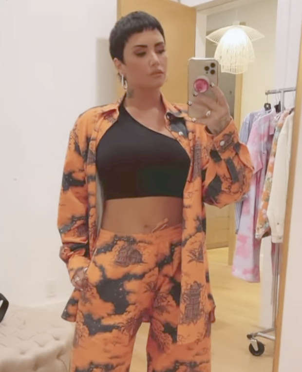Demi Lovator sets summer vibe in her printed orange co-ords with Balenciaga boots worth Rs. 82,000