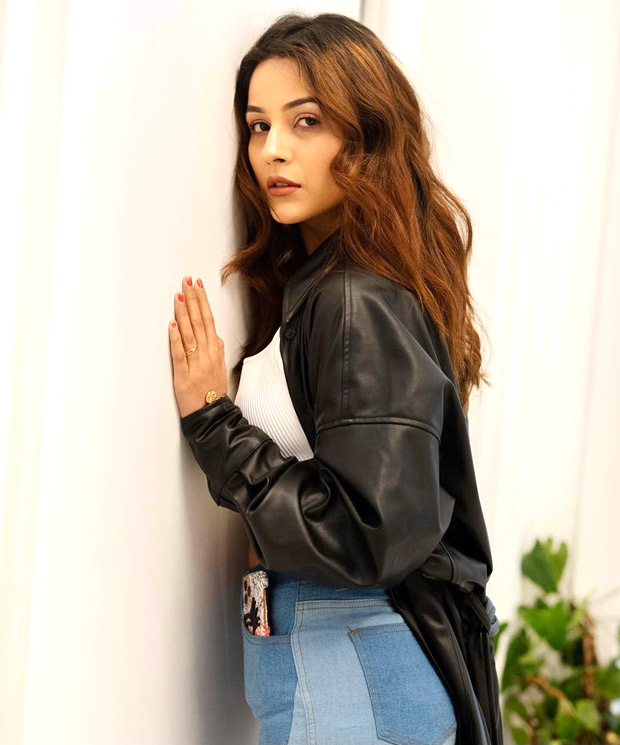 Shehnaaz Gill dons crop top and jeans with leather jacket as she returns from Canada after wrapping Honsla Rakh