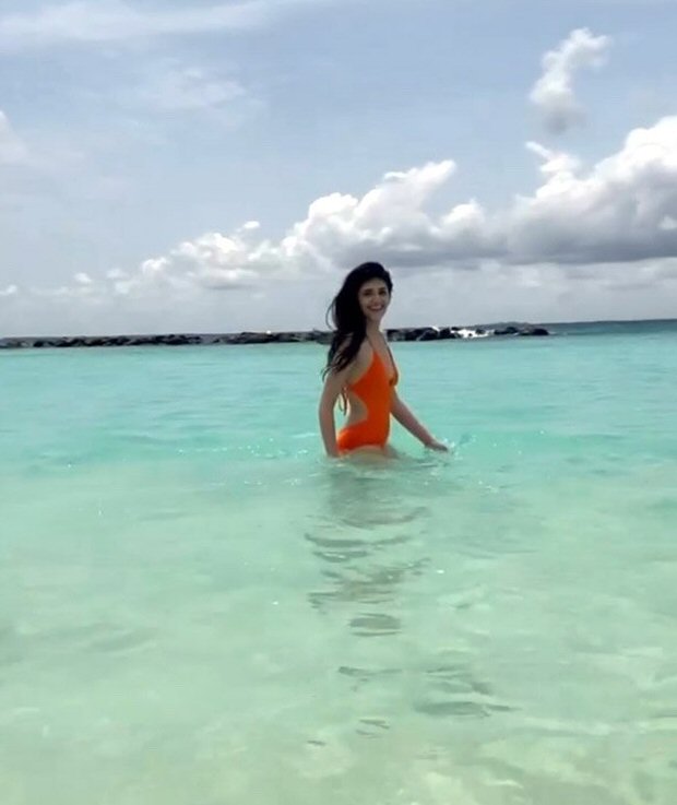 Sanjana-Sanghi-makes-a-splash-in-orange-swimsuit-while-holidaying-in-Maldives-2.jpg