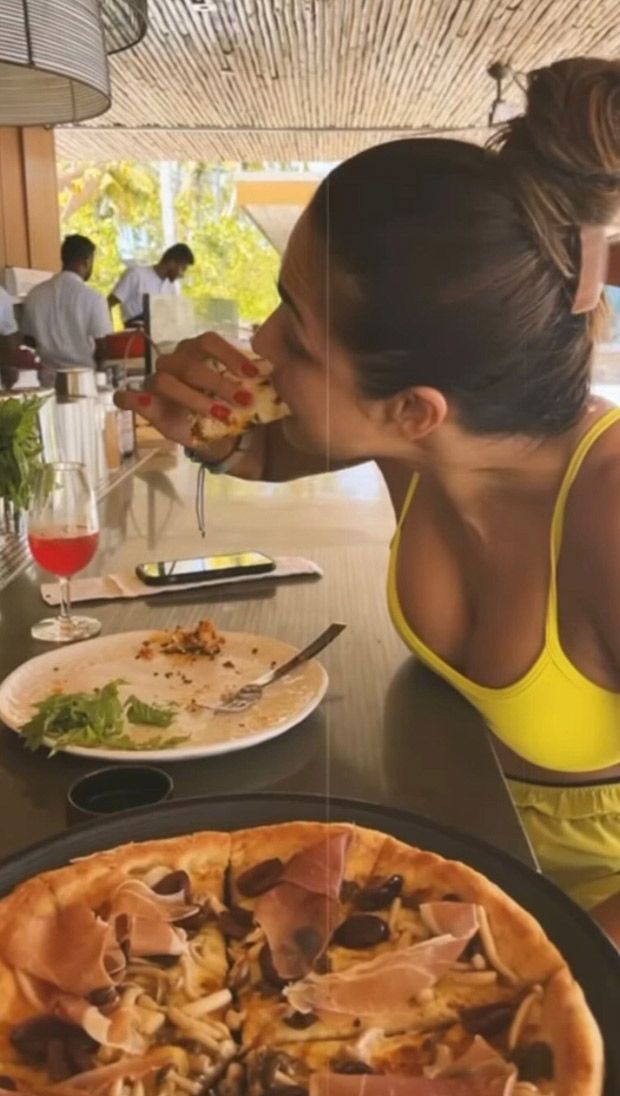 Malaika Arora feasts on pizza, poses on a sailboat in a bikini as she vacations in Maldives with Arjun Kapoor