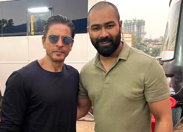 Shah Rukh Khan poses in a black T-shirt in latest picture from the sets of a film