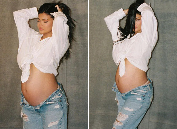 Kylie Jenner flaunts her growing baby bump - "I Am Woman"