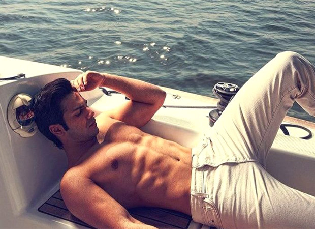 Varun Dhawan poses shirtless on a boat in the middle of the sea; Katrina Kaif reacts