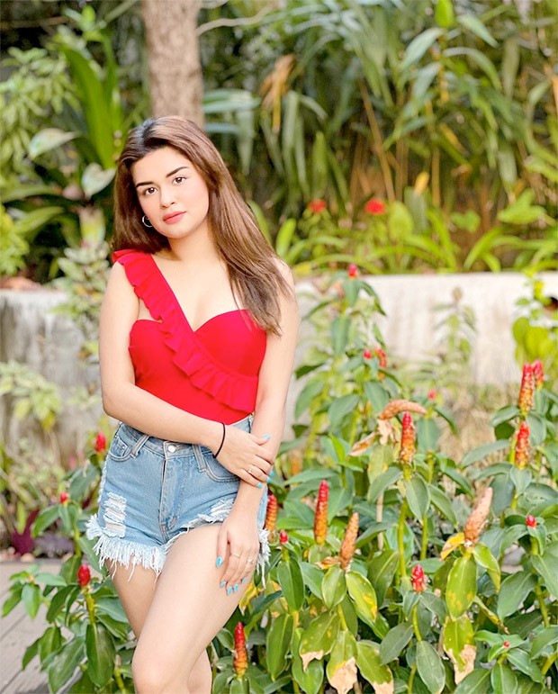 Avneet Kaur sizzles in flaming red oneshoulder monokini and shorts as