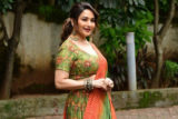 Madhuri Dixit poses in green lehenga and heavy earrings