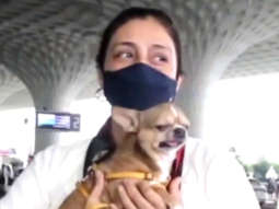 Tabu snapped at the airport with her cute little dog